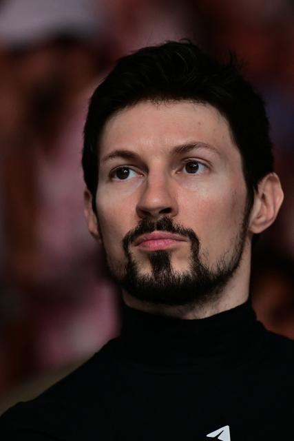 (FILES) Telegram messaging app CEO and co-founder Pavel Durov watches the bantamweight bout between Russias Said Nurmagomedov and US' Mario Bautista at UFC 321 at Etihad Arena in Abu Dhabi on October 25, 2025. Telegram founder Pavel Durov on February 4, 2026 joined fellow tech tycoon Elon Musk in slamming Spanish Prime Minister Pedro Sanchez over his "dangerous" plan to ban social media for under-16s. The Socialist leader announced a series of measures in Dubai on February 3, 2026 to protect Spanish minors from harmful social media content such as violence and pornography. (Photo by Giuseppe CACACE / AFP)