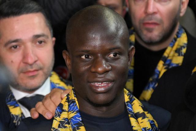 France midfielder Ngolo Kante reacts as he arrives at Sabiha Gokcen Airport to complete his transfer to Turkish football club Fenerbahce, in Istanbul on February 4, 2026. France midfielder Ngolo Kante has signed for Fenerbahce from Saudi side Al-Ittihad thanks to "support" from Turkey's President Recep Tayyip Erdogan, the Turkish club said on February 4, 2026. (Photo by Ozan KOSE / AFP)