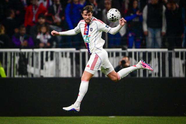 Lyon’s Dutch defender #03 Hans Hateboer heads the ball during the French Cup round of 16 football match between Olympique Lyonnais and Laval Stade Mayenne FC at Groupama Stadium in Lyon on February 4, 2026. (Photo by OLIVIER CHASSIGNOLE / AFP)