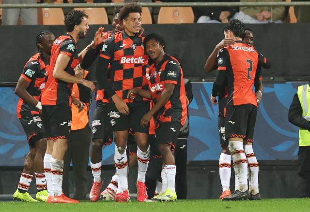 Lorient's players celebrate after scoring their first goal during the French Cup round of 16 football match between Lorient FC and Paris FC at the Stade du Moustoir in Lorient on February 4, 2026. (Photo by Fred TANNEAU / AFP)