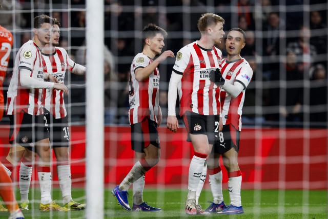 PSV Eindhoven's Bosnian forward #19 Esmir Bajraktarevic (C) celebrates with teammates after scoring a goal during the KNVB Cup quarterfinal football match between PSV Eindhoven and SC Heerenveen at the Philips Stadium in Eindhoven on February 4, 2026. (Photo by Bas Czerwinski / ANP / AFP) / Netherlands OUT