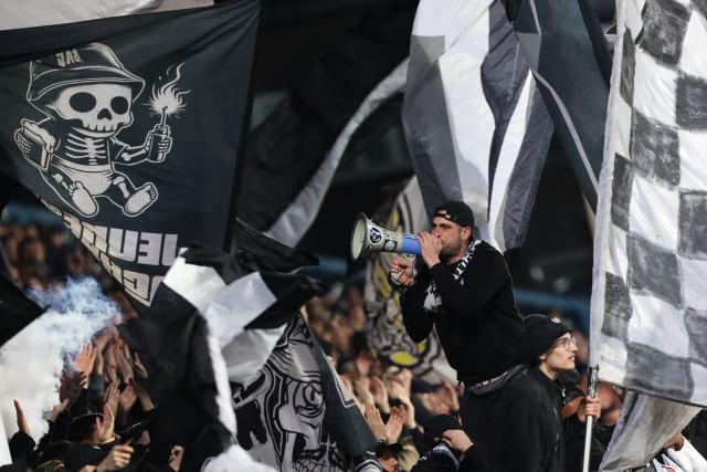 Royal Charleroi's supporters cheer their team on from the stands during the semi final first leg of the Belgium 'Croky Cup' between Sporting Charleroi and Royale Union Saint-Gilloise at the Stade du Pays de Charleroi, in Charleroi, on February 4, 2026. (Photo by VIRGINIE LEFOUR / Belga / AFP) / Belgium OUT