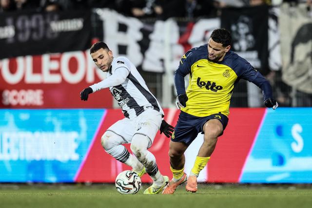 Royal Charleroi SC's Algerian midfielder #22 Yassine Titraoui (L) and Royale Union Saint-Gilloise's Algerian midfielder #08 Adem Zorgane (R) fight for the ball during the semi final first leg of the Belgium 'Croky Cup' between Sporting Charleroi and Royale Union Saint-Gilloise at the Stade du Pays de Charleroi, in Charleroi, on February 4, 2026. (Photo by BRUNO FAHY / Belga / AFP) / Belgium OUT