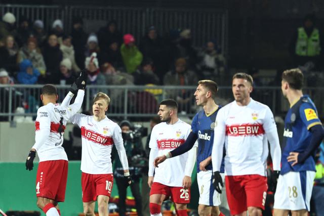 Stuttgart's German midfielder #10 Chris Fuehrich (2nd L) celebrates with team mates after scoring the 0-2 goal during the German Cup (DFB-Pokal) quartefinal football match between Holstein Kiel and VfB Stuttgart in Kiel, northern Germany on February 4, 2026. (Photo by IBRAHIM OT / AFP) / DFB REGULATIONS PROHIBIT ANY USE OF PHOTOGRAPHS AS IMAGE SEQUENCES AND QUASI-VIDEO.