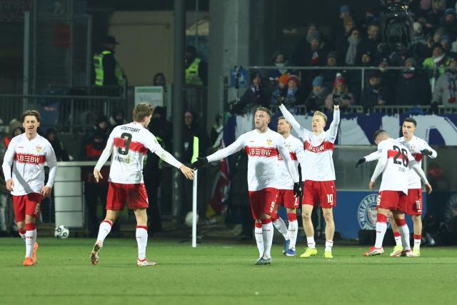 Stuttgart's German midfielder #10 Chris Fuehrich (3rd R) celebrates with team mates after scoring the 0-2 goal during the German Cup (DFB-Pokal) quartefinal football match between Holstein Kiel and VfB Stuttgart in Kiel, northern Germany on February 4, 2026. (Photo by IBRAHIM OT / AFP) / DFB REGULATIONS PROHIBIT ANY USE OF PHOTOGRAPHS AS IMAGE SEQUENCES AND QUASI-VIDEO.