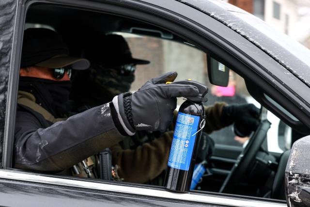 US federal immigration agents patrol in Minneapolis, Minnesota, on February 4, 2026. US President Donald Trump's administration announced the removal of 700 immigration officers from Minnesota after weeks of aggressive and sometimes violent operations and the fatal shooting of two protesters that sparked outrage across the United States. (Photo by Charly TRIBALLEAU / AFP)