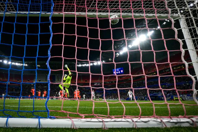 Lyon’s Brazilian forward #09 Endrick scores the first goal past Laval's French goakeeper #01 Maxime Hautboisduring the French Cup round of 16 football match between Olympique Lyonnais and Laval Stade Mayenne FC at Groupama Stadium in Lyon on February 4, 2026. (Photo by OLIVIER CHASSIGNOLE / AFP)