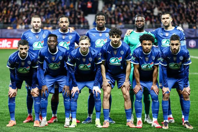 Troyes' players pose for a team photograph ahead of the French Cup round of 16 football match between Estac Troyes and Lens RC at the Stade de l'Aube in Troyes on February 4, 2026. (Photo by Sameer Al-DOUMY / AFP)