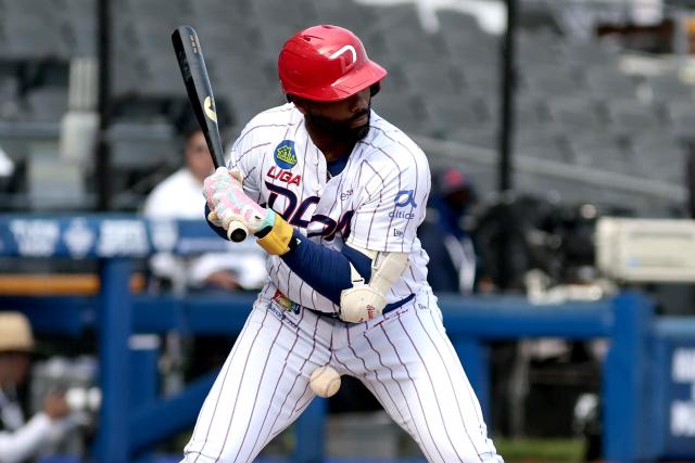 Leones del Escogido's #18 Aderlin Rodriguez bats in the third inning of the Caribbean Series baseball tournament seventh game between Panama's Federales de Chiriqui and Dominican Republic's Leones del Escogido at the Panamerican Stadium in Jalisco, Mexico, on February 4, 2026. (Photo by Ulises Ruiz / AFP)
