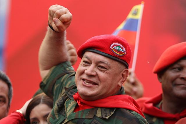 Minister of the Popular Power for Interior, Justice, and Peace of Venezuela Diosdado Cabello gestures during a march by 'Chavismo' supporters to commemorate the 34th anniversary of a coup attempt by Hugo Chavez, in Maracay, Aragua state, Venezuela, on February 4, 2026. (Photo by Pedro MATTEY / AFP)
