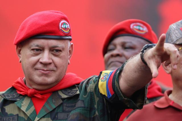 Minister of the Popular Power for Interior, Justice, and Peace of Venezuela Diosdado Cabello gestures during a march by 'Chavismo' supporters to commemorate the 34th anniversary of a coup attempt by Hugo Chavez, in Maracay, Aragua state, Venezuela, on February 4, 2026. (Photo by Pedro MATTEY / AFP)