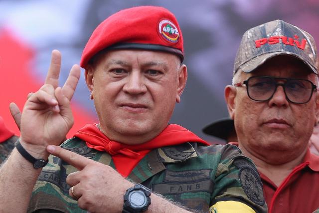 TOPSHOT - Minister of the Popular Power for Interior, Justice, and Peace of Venezuela Diosdado Cabello gestures during a march by 'Chavismo' supporters to commemorate the 34th anniversary of a coup attempt by Hugo Chavez, in Maracay, Aragua state, Venezuela, on February 4, 2026. (Photo by Pedro MATTEY / AFP)