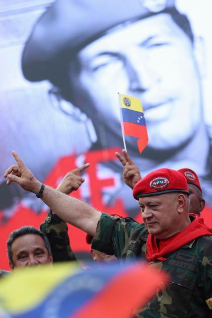 Minister of the Popular Power for Interior, Justice, and Peace of Venezuela Diosdado Cabello gestures during a march by 'Chavismo' supporters to commemorate the 34th anniversary of a coup attempt by Hugo Chavez, in Maracay, Aragua state, Venezuela, on February 4, 2026. (Photo by Pedro MATTEY / AFP)