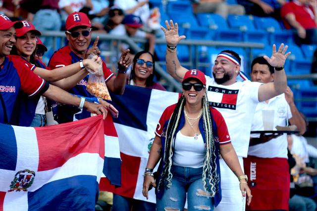 Leones del Escogido fans attend the seventh game of the Caribbean Series baseball tournament between Panama's Federales de Chiriqui and Dominican Republic's Leones del Escogido at the Panamerican Stadium in Jalisco, Mexico, on February 4, 2026. (Photo by Ulises Ruiz / AFP)