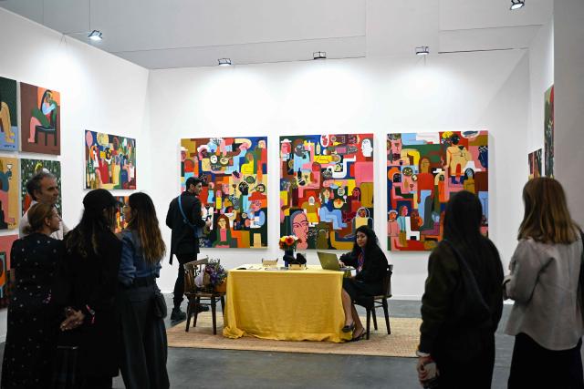 People attend the first day of Mexico Art Week, the largest art fair in Latin America, which draws artists and collectors from around the world, in Mexico City on February 4, 2026. The annual fair runs from February 4 to February 8, 2026. (Photo by Carl de Souza / AFP)