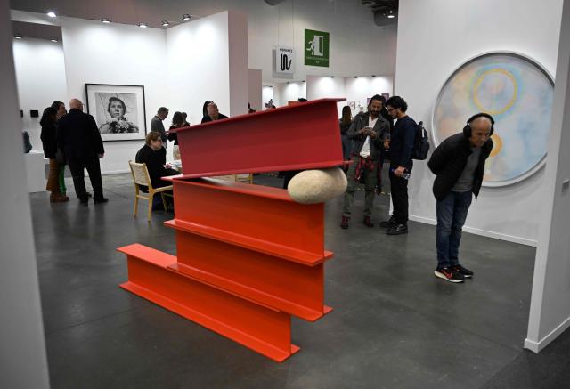 People attend the first day of Mexico Art Week, the biggest Art fair in Latin America, drawing artists and collectors from all over the world in Mexico City on February 4, 2026. The annual fair runs from February 4 until February 8, 2026. (Photo by Carl de Souza / AFP)