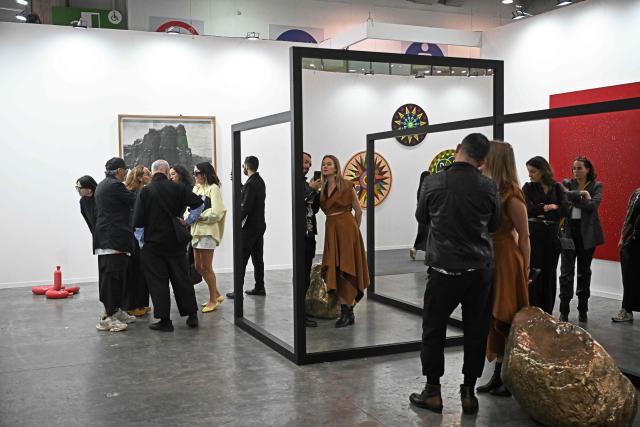 People attend the first day of Mexico Art Week, the biggest Art fair in Latin America, drawing artists and collectors from all over the world in Mexico City on February 4, 2026. The annual fair runs from February 4 until February 8, 2026. (Photo by Carl de Souza / AFP)