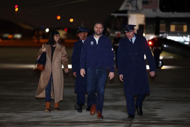 US Vice President JD Vance and Second Lady Usha Vance walk as they prepare to board Air Force Two for the Milano Cortina 2026 Winter Olympics in Italy, from Joint Base Andrews, Maryland, on February 4, 2026. (Photo by Kevin Lamarque / POOL / AFP)