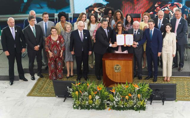 From-row: (3nd L) President of Brazil's Supreme Court Edson Fachin, President of the Federal Senate Davi Alcolumbre, Rosangela "Janja" da Silva, Brazil's First Lady Janja Lula da Silva, Brazil's President Luiz Inacio Lula da Silva, and President of the Chamber of Deputies Hugo Motta attend the launch ceremony of the Brazil Pact to Combat Femicide at the Planalto Palace in Brasilia, Brazil, on February 4, 2026. (Photo by Sergio Lima / AFP)