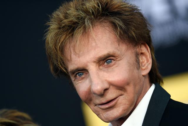(FILES) Singer Barry Manilow attends the premiere of "A star is born" at the Shrine Auditorium in Los Angeles, California on September 24, 2018. US singer-songwriter Barry Manilow on February 4 announced the cancellation of his upcoming run of shows in Las Vegas, but assured fans he was recovering well from surgery to remove lung cancer. The 82-year-old crooner, known for 1970s hits "Copacabana" and "Mandy," revealed a lung cancer diagnosis in December and planned to have an operation to treat it. "I'm doing great and recovering very well after my surgery," he said in a post on Instagram. (Photo by VALERIE MACON / AFP)