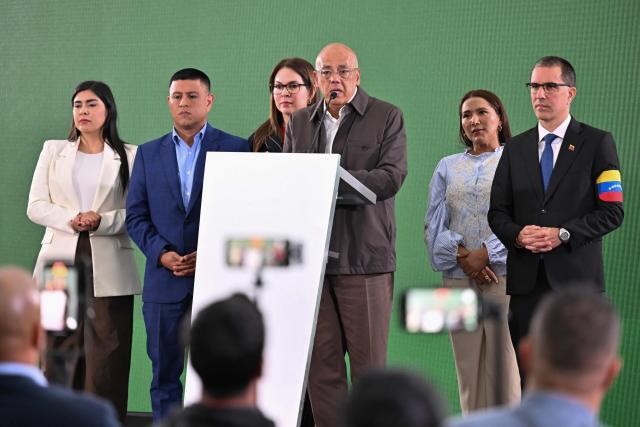 The President of the National Assembly of Venezuela, Jorge Rodriguez (C), speaks next to second vice-president Grecia Colmenares (L), first vice-president Pedro Jose Infante (2nd-L), and Deputy Jorge Arreaza (R) during a press conference after a meeting with the Commission for Democratic Coexistence and Peace in Venezuela in Caracas on February 4, 2026. (Photo by Juan BARRETO / AFP)