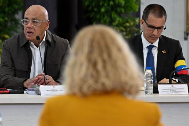 The President of the National Assembly of Venezuela, Jorge Rodriguez (L), speaks next to Deputy Jorge Arreaza during a meeting with the Commission for Democratic Coexistence and Peace in Venezuela in Caracas on February 4, 2026. (Photo by Juan BARRETO / AFP)