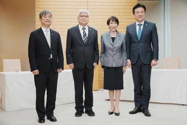 Japan's Prime Minister Sanae Takaichi (2nd R) and Chief Cabinet Secretary Minoru Kihara (R) pose with TSMC Chairman CC Wei (2nd L) and Vice President Jonathan Lee (L) at the beginning of their meeting at the Prime Minister's Office in Tokyo on February 5, 2026. (Photo by Kazuhiro NOGI / POOL / AFP)