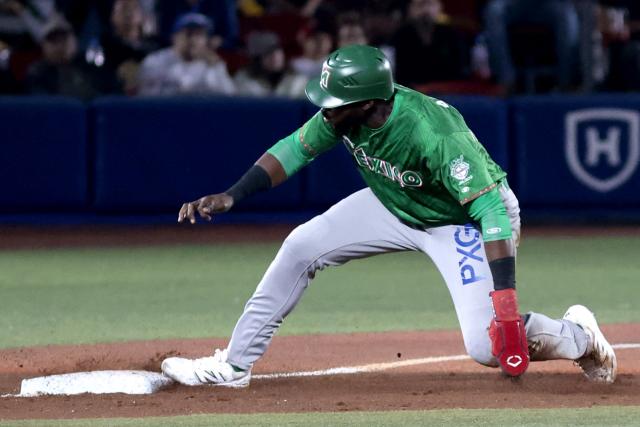Tomateros de Culiacan's #47 Estevan Florial slides to third base in the second inning of the Caribbean Series baseball tournament eight game between Mexico's Tomateros de Culiacan and Mexico's Charros de Jalisco at the Panamerican Stadium in Jalisco, Mexico, on February 4, 2026. (Photo by Ulises Ruiz / AFP)