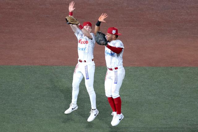Players of Charros de Jalisco celebrate at the end of the ninth inning of the Caribbean Series baseball tournament eight game between Mexico's Tomateros de Culiacan and Mexico's Charros de Jalisco at the Panamerican Stadium in Jalisco, Mexico, on February 4, 2026. (Photo by Ulises Ruiz / AFP)