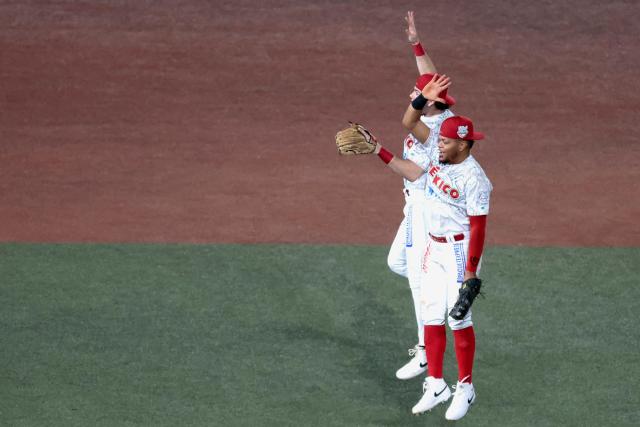 Players of Charros de Jalisco celebrate at the end of the ninth inning of the Caribbean Series baseball tournament eight game between Mexico's Tomateros de Culiacan and Mexico's Charros de Jalisco at the Panamerican Stadium in Jalisco, Mexico, on February 4, 2026. (Photo by Ulises Ruiz / AFP)