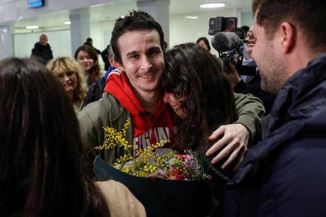 French national Tom Felix is greeted by friends and relatives as he arrives at Roissy-Charles de Gaulle Airport after he was acquitted on eight drug-related charges at the Malaysian High Court, on the outskirts of Paris, on February 5, 2026. A Malaysian court acquitted on February 3 the French national who was facing the death penalty on eight drug-related charges, freeing him after nearly two and a half years in detention. (Photo by GEOFFROY VAN DER HASSELT / AFP)