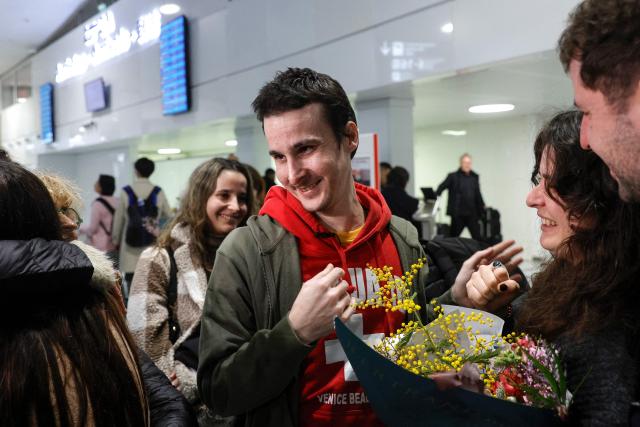 French national Tom Felix is greeted by friends and relatives as he arrives at Roissy-Charles de Gaulle Airport after he was acquitted on eight drug-related charges at the Malaysian High Court, on the outskirts of Paris, on February 5, 2026. A Malaysian court acquitted on February 3 the French national who was facing the death penalty on eight drug-related charges, freeing him after nearly two and a half years in detention. (Photo by GEOFFROY VAN DER HASSELT / AFP)
