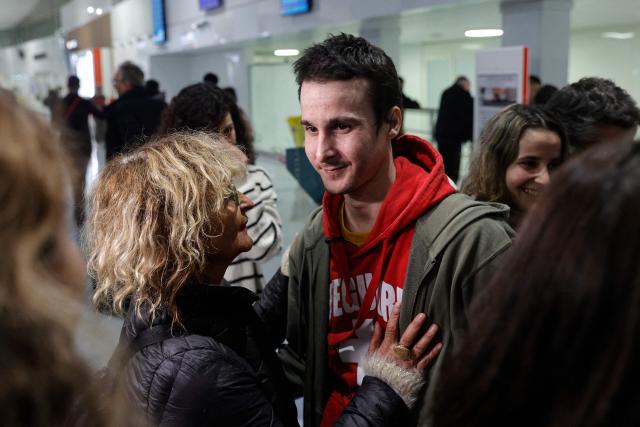 French national Tom Felix is greeted by his mother as he arrives at Roissy-Charles de Gaulle Airport after he was acquitted on eight drug-related charges at the Malaysian High Court, on the outskirts of Paris, on February 5, 2026. A Malaysian court acquitted on February 3 the French national who was facing the death penalty on eight drug-related charges, freeing him after nearly two and a half years in detention. (Photo by GEOFFROY VAN DER HASSELT / AFP)