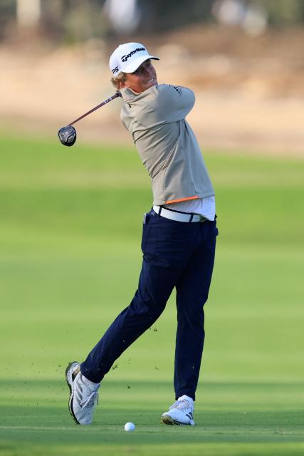 France's Martin Couvra plays a shot on the 16th hole on day one of the Qatar Masters 2026 at Doha Golf Club, in Doha on February 5, 2026. (Photo by Karim JAAFAR / AFP)