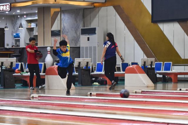 A player takes part in a bowling tournament held at the Pyongyang Gold Lane in Pyongyang on February 5, 2026. (Photo by KIM Won Jin / AFP)
