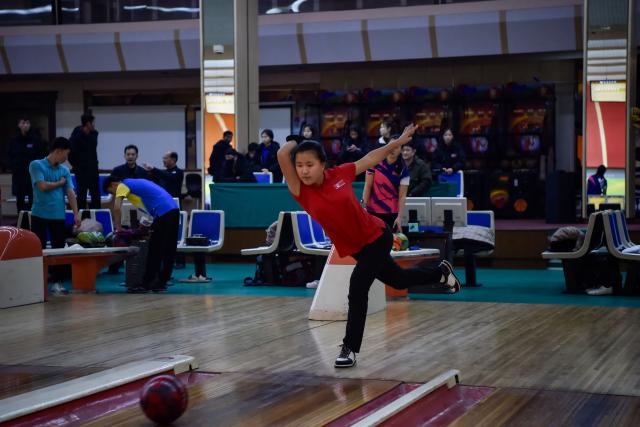 A player takes part in a bowling tournament held at the Pyongyang Gold Lane in Pyongyang on February 5, 2026. (Photo by KIM Won Jin / AFP)