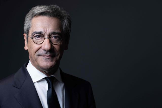 (FILES) France's Trade Minister, Serge Papin poses during a photo session in his office at the French Ministry for the Economy and Finances, also known as "Bercy", in Paris on November 10, 2025. "Direct", a proponent of "compromise" and drawing on his field experience, the former self-taught boss of Systeme U, Serge Papin, is imprinting his style on the Ministry of Trade, calling for "showing one's fist" against "Chinese-American predators," Shein in the lead. (Photo by JOEL SAGET / AFP)