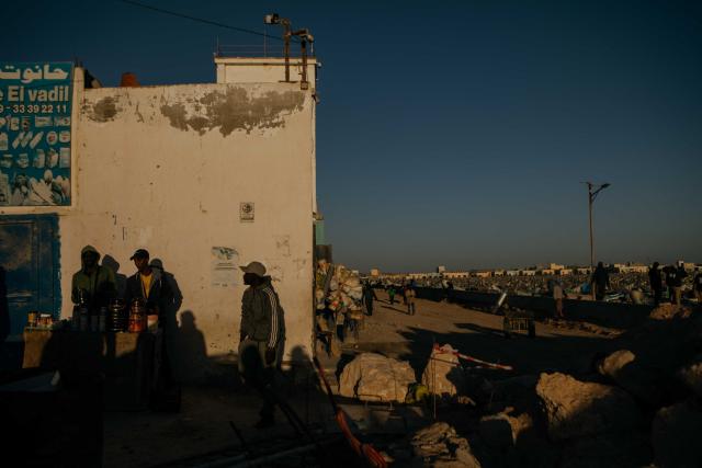 A general view of traders late afternoon at the Artisanal fishing Port in Nouadhibou on February 3, 2026. (Photo by Kang-Chun Cheng / AFP)
