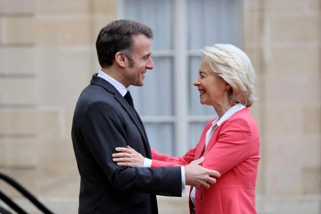 France's President Emmanuel Macron (L) welcomes European Commission President Ursula von der Leyen (R) for a meeting at The Elysee Palace in Paris on February 5, 2026. (Photo by Ludovic MARIN / AFP)
