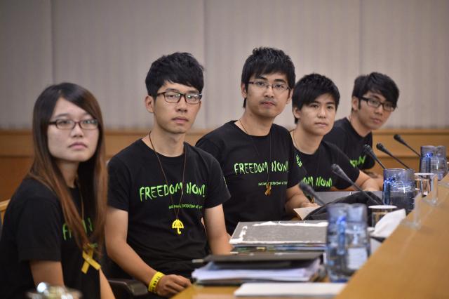 (FILES) Leaders of the Hong Kong Federation of Students (L-R) Yvonne Leung, Nathan Law, Alex Chow, Lester Shum and Eason Chung arrive for talks with Hong Kong authorities, aimed at ending weeks of rallies, on the same day the city's leader ruled out democratic reforms, in Hong Kong on October 21, 2014. A pro-democracy student organisation in Hong Kong said on February 5, 2026 its members had decided to dissolve, citing "increasingly severe pressures". Established in 1958, the Hong Kong Federation of Students (HKFS) played a leading role in mobilising the Chinese city's student community to participate in once-vibrant social movements. (Photo by PHILIPPE LOPEZ / AFP)