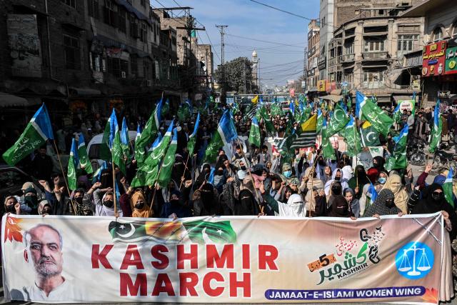 Activists and supporters of the Jamaat-e-Islami party take part in a rally to mark Pakistan's Kashmir Solidarity Day in Peshawar on February 5, 2026. (Photo by Abdul MAJEED / AFP)