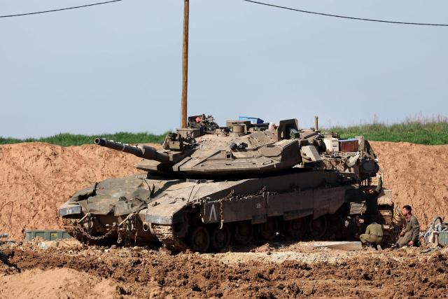This picture taken from a position at Israel's border with the Gaza Strip shows Israeli troops deployed near the border fence with the besieged Palestinian territory on February 5, 2026. The October 7, 2023, Hamas attack just across the Israel-Gaza Strip border which resulted in the deaths of 1,221 people on the Israeli side, triggered the Gaza war in which over 71,800 Palestinians have been killed and thousands of buildings destroyed. (Photo by Jack GUEZ / AFP)