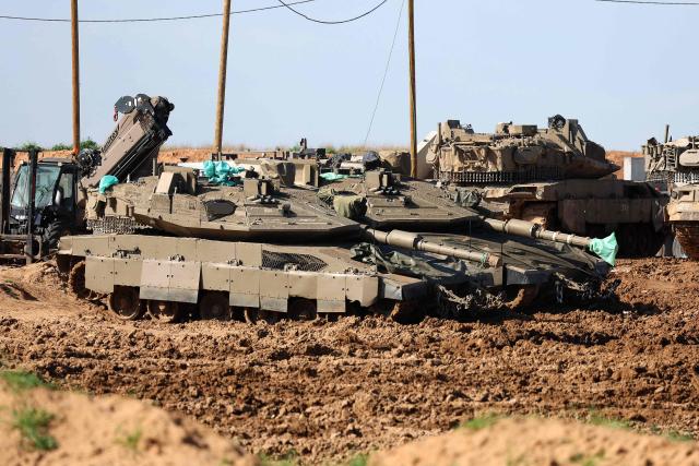 This picture taken from a position at Israel's border with the Gaza Strip shows Israeli troops deployed near the border fence with the besieged Palestinian territory on February 5, 2026. The October 7, 2023, Hamas attack just across the Israel-Gaza Strip border which resulted in the deaths of 1,221 people on the Israeli side, triggered the Gaza war in which over 71,800 Palestinians have been killed and thousands of buildings destroyed. (Photo by Jack GUEZ / AFP)