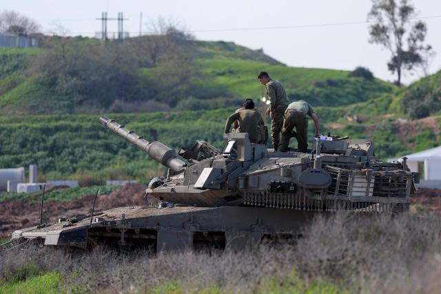 This picture taken from a position at Israel's border with the Gaza Strip shows Israeli troops deployed near the border fence with the besieged Palestinian territory on February 5, 2026. The October 7, 2023, Hamas attack just across the Israel-Gaza Strip border which resulted in the deaths of 1,221 people on the Israeli side, triggered the Gaza war in which over 71,800 Palestinians have been killed and thousands of buildings destroyed. (Photo by Jack GUEZ / AFP)