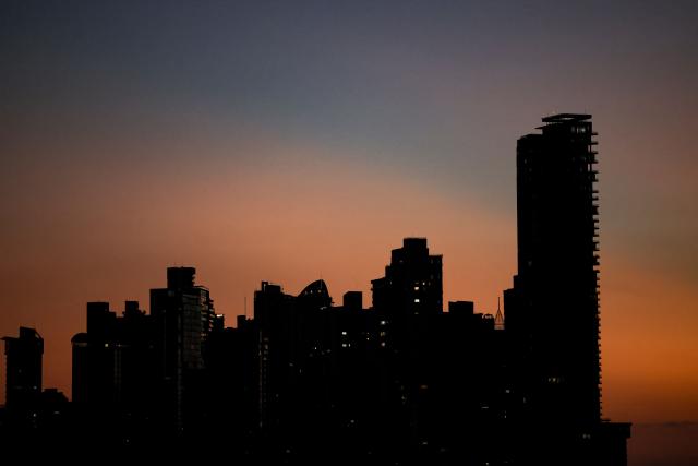 View of the skyline in Paitilla neighborhood during sunrise in Panama City, on February 5, 2026. (Photo by MARTIN BERNETTI / AFP)