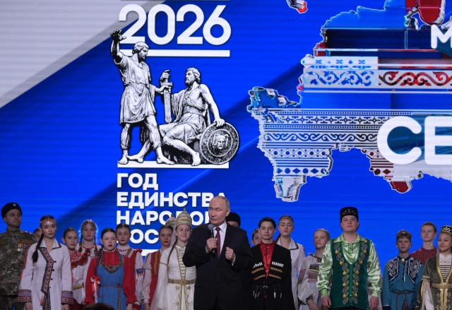 In this pool photograph distributed by the Russian state agency Sputnik, Russia's President Vladimir Putin attends a ceremony opening the Year of Unity of the Peoples of Russia, in Moscow on February 5, 2026. (Photo by Alexey NIKOLSKY / POOL / AFP)