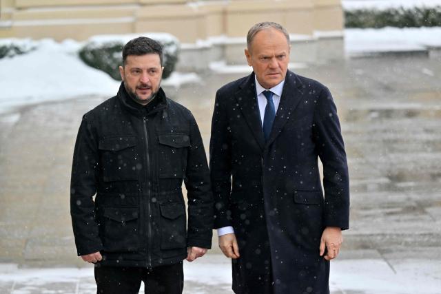 Ukrainian President Volodymyr Zelensky (L) and Poland's Prime Minister Donald Tusk (R) pose for media during their meeting at the Mariinskyi Palace in Kyiv on February 5, 2026 amid Russian invasion in Ukraine. (Photo by Sergei SUPINSKY / AFP)