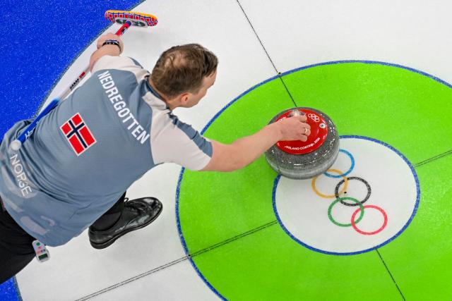 Norway's Magnus Nedregotten curls the stone in the curling mixed doubles round robin between Norway and Canada during the Milano Cortina 2026 Winter Olympic Games at the Cortina Curling Olympic Stadium in Cortina d’Ampezzo on February 5, 2026. (Photo by Odd ANDERSEN / AFP)