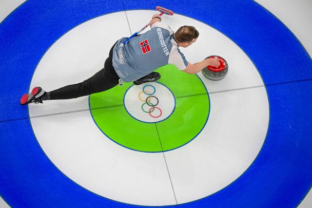 Norway's Magnus Nedregotten curls the stone in the curling mixed doubles round robin between Norway and Canada during the Milano Cortina 2026 Winter Olympic Games at the Cortina Curling Olympic Stadium in Cortina d’Ampezzo on February 5, 2026. (Photo by Odd ANDERSEN / AFP)