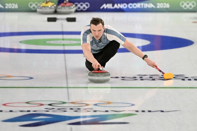 Norway's Magnus Nedregotten curls the stone in the curling mixed doubles round robin between Norway and Canada during the Milano Cortina 2026 Winter Olympic Games at the Cortina Curling Olympic Stadium in Cortina d’Ampezzo on February 5, 2026. (Photo by Tiziana FABI / AFP)